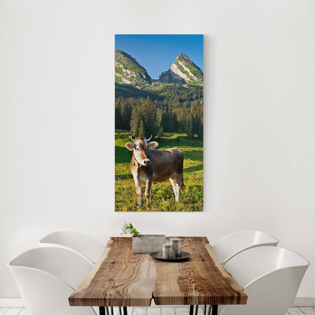 Canvastavlor bergen Swiss Alpine Meadow With Cow